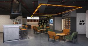 a restaurant with chairs and tables and a bar at Mcsrh Hotel-GuiYang Xiaoshizi in Guiyang