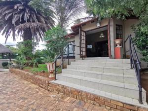 a set of stairs leading to a house at Catwalk Lodge in Pretoria +7 photos