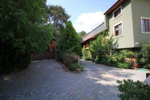 a driveway in front of a house at Padok Premium Hotel & Stables in Gökova