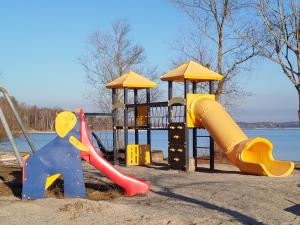 a playground with two slides and a play structure at Auszeit am Chiemsee in Prien am Chiemsee