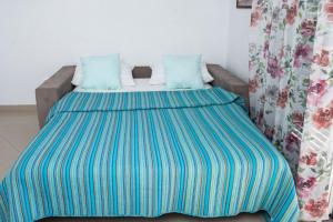 Ένα ή περισσότερα κρεβάτια σε δωμάτιο στο Gloria