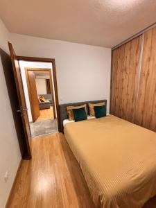 a bedroom with two beds and a mirror at R-RESIDENCY ll in Banja Luka