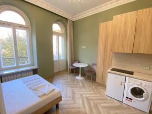 Ένα ή περισσότερα κρεβάτια σε δωμάτιο στο ВІП Аппартаменти на Малій Арнаутській,59