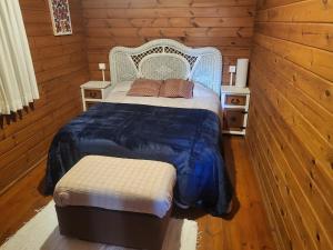 a bedroom with a bed and two night stands at Casa Madera Urbanizacion Socorro in Seville +26 photos