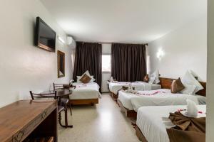 Postel nebo postele na pokoji v ubytování Hotel Le Grand Imilchil