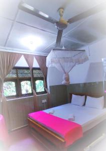 Postel nebo postele na pokoji v ubytování New Araliya Resort