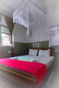 Postel nebo postele na pokoji v ubytování New Araliya Resort + 37 fotografií