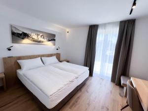 Postel nebo postele na pokoji v ubytování LES VIGNES - Appartamenti vacanze Valle d'Aosta