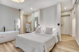 Voodi või voodid majutusasutuse Welchome - Suites toas