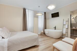 Voodi või voodid majutusasutuse Welchome - Suites toas