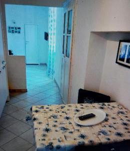 a table with a plate on it in a room at Appartamentino Bianco in Rio Marina