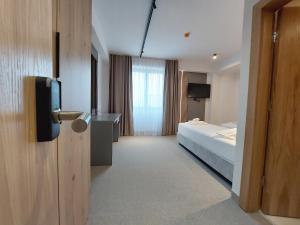 Letto o letti in una camera di Hotel Almanas