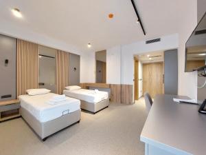 Postel nebo postele na pokoji v ubytování Hotel Almanas + 16 fotografií