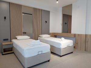 Letto o letti in una camera di Hotel Almanas