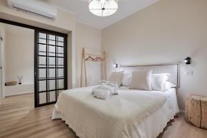 Voodi või voodid majutusasutuse Welchome - Suites toas