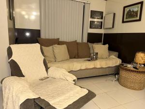 a living room with a couch and a chair at Entire House inside Residential Area, Banilad Cebu in Cebu City