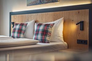 Ένα ή περισσότερα κρεβάτια σε δωμάτιο στο Hotel Bad Neunbrunnen am Waldsee - non Halal
