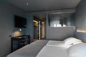 Letto o letti in una camera di Barcelona Princess