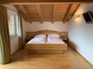 Postel nebo postele na pokoji v ubytování Penthouse Kurz