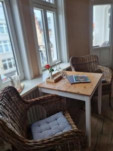 a living room with a table and two chairs at Gästehaus Cafe Orth Zimmer 4 in Westerland (Sylt)