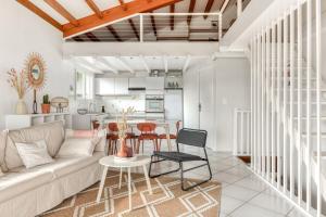 a living room with a couch and a table at Casa Lacambra - Leucate Plage - 8 People in Leucate