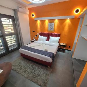 a bedroom with a bed in a room at Villa à louer in Saly Portudal +72 photos