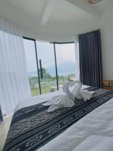 Postel nebo postele na pokoji v ubytování TUGU Bali glamping