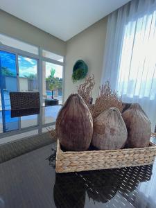 a basket of coconuts on a table in a room at Villa VP One - Punta rucia beach in Punta Rucia
