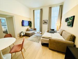 a living room with a couch and a table at Panda Apartment in Vienna