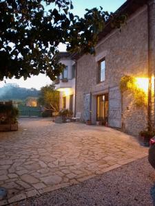 a large stone patio in front of a building at PACA casa rural. Arts and Landscape in Asturias in Gijón