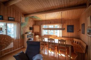 a dining room with a table and chairs at Trysilfjellet Nord 637 in Trysil +15 photos