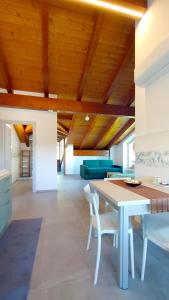 a dining room with a table and chairs at La Carpa e la Calendula - Appartamenti Vacanze in Niella Tanaro
