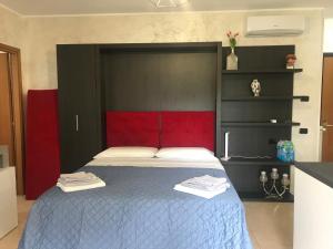 Postel nebo postele na pokoji v ubytování Casa diva - giardino e box auto