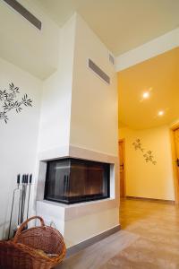 a living room with a fireplace in the wall at Słoneczny Pacyfik in Kościelisko