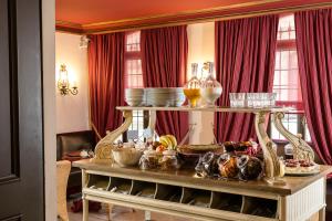 a table with a bunch of dishes on it at Le Cavendish in Cannes