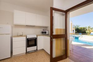 Kuchyňa alebo kuchynka v ubytovaní Apartamentos Casa del Sol