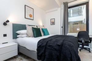 Postel nebo postele na pokoji v ubytování Xylo Apartments - Kentish Town