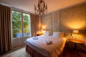Postel nebo postele na pokoji v ubytování B&B De Corenbloem Luxury Guesthouse - Adults Only
