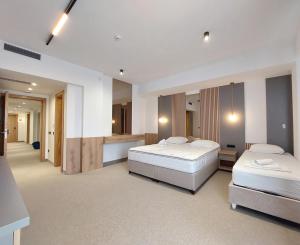 Letto o letti in una camera di Hotel Almanas