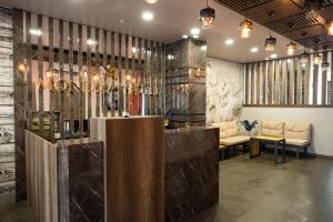 a lobby with a bar with a sign that reads novation at Monezza Maltepe Rezidans in Istanbul