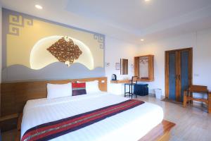 Postel nebo postele na pokoji v ubytování Chenfong Rakthai Resort-ไร่ชาเฉินฟงรีสอร์ท