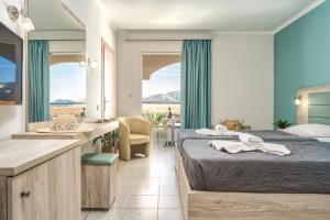 Voodi või voodid majutusasutuse Poseidon Beach Hotel toas
