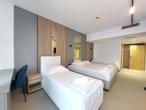 Postel nebo postele na pokoji v ubytování Hotel Almanas
