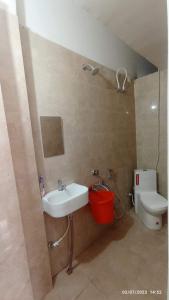 a bathroom with a sink and a toilet at Capsule Hostel And PG Services in Gorakhpur