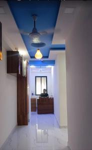 a man is sitting at a desk in an office at Hotel CBD in Navi Mumbai