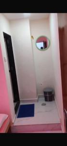 a small bathroom with a mirror on the wall at Hotel CBD in Navi Mumbai