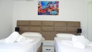 Postel nebo postele na pokoji v ubytování Hotel Keli