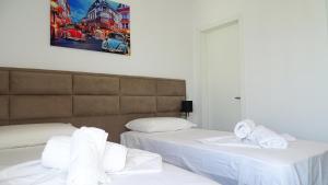 Postel nebo postele na pokoji v ubytování Hotel Keli