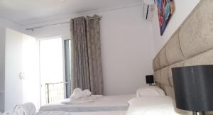 Postel nebo postele na pokoji v ubytování Hotel Keli
