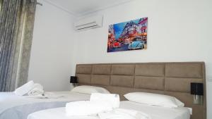 Postel nebo postele na pokoji v ubytování Hotel Keli